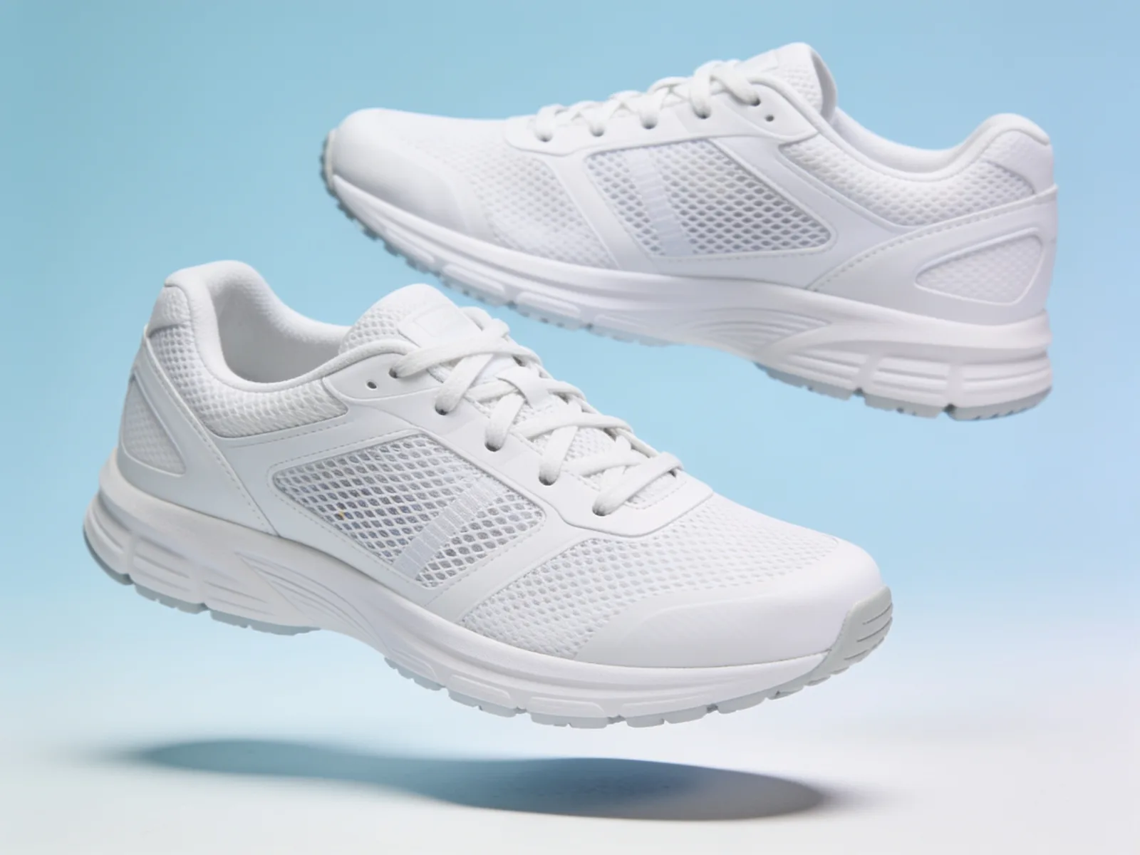 White running shoes on pastel blue